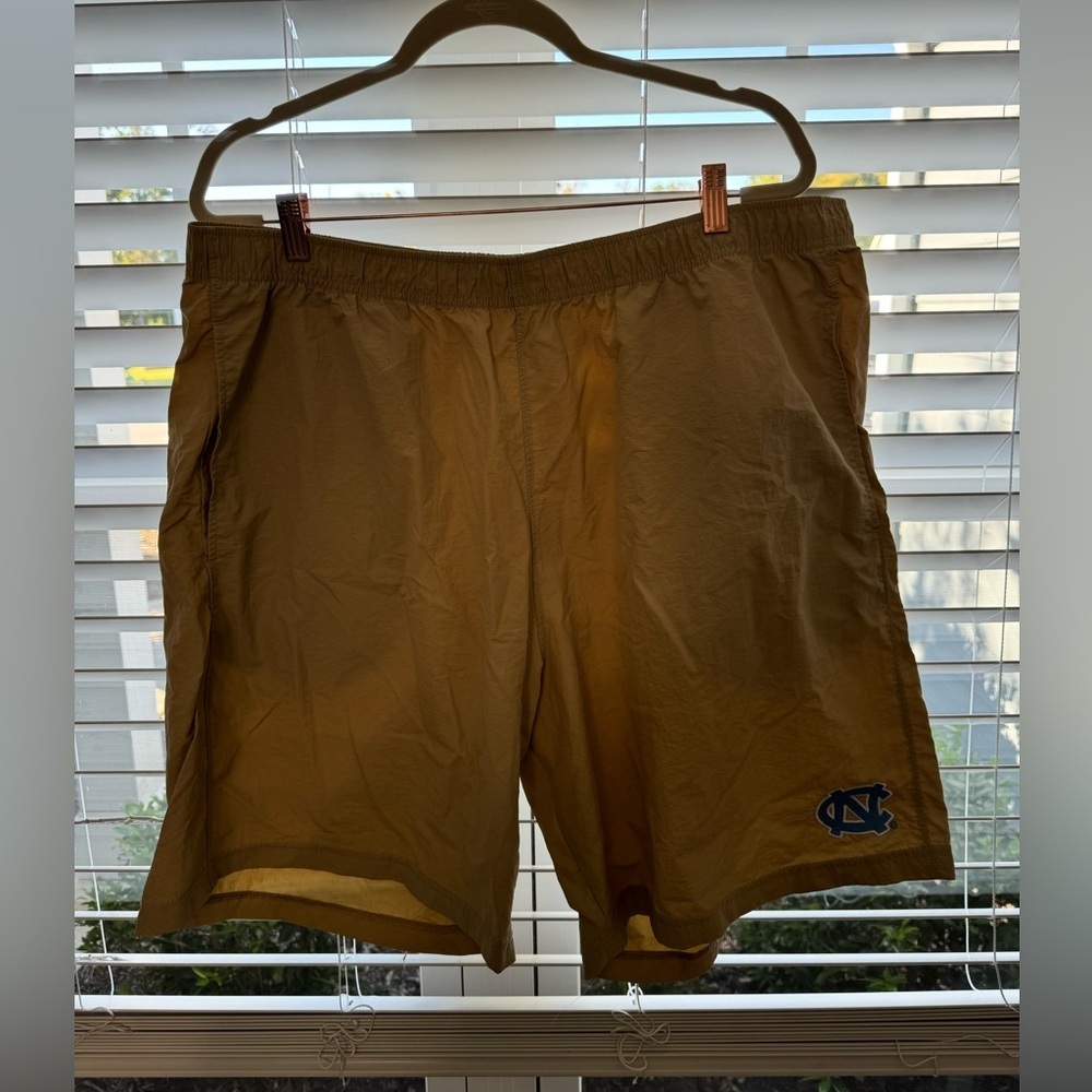 Khaki colored men’s shorts (Nylon) with UNC logo size xl